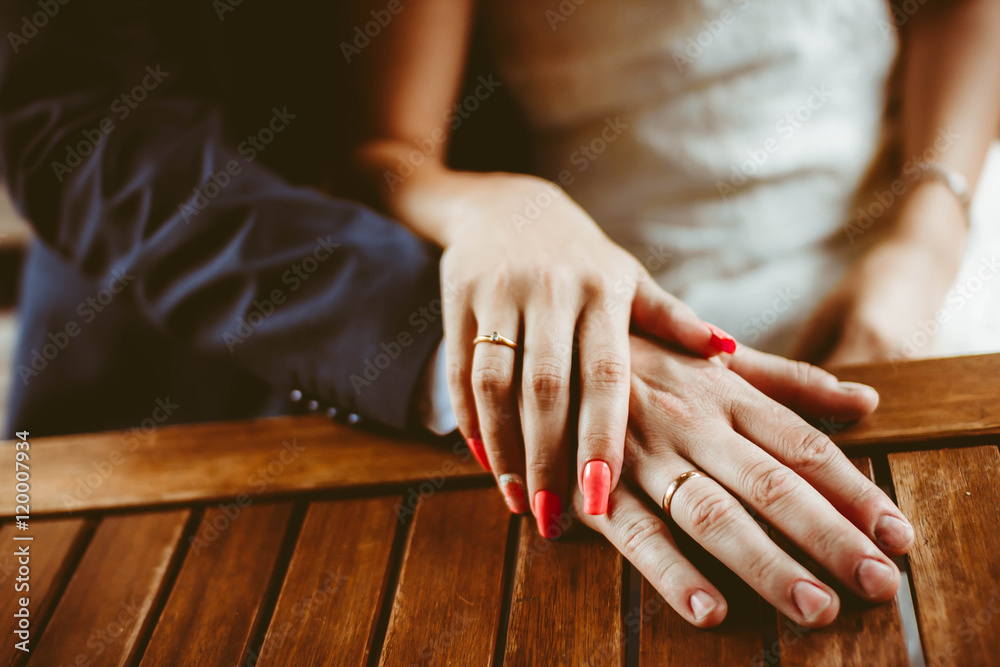hands of newlyweds with rings hands of newlyweds with rings