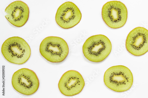 Pattern of pieces sliced cross of  kiwi on white background.