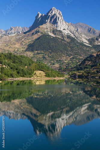 Penya Foratata reflected in the Lanuza reservoir photo