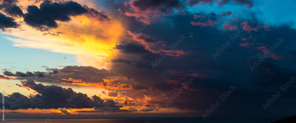 Abstract background of beautiful sunrise and dramatic clouds on the sky.