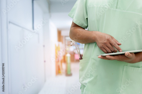 Doctor working with tablet in hospital