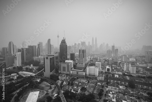 Top view of Kuala Lumper skyline during bad hazy day on warm sun