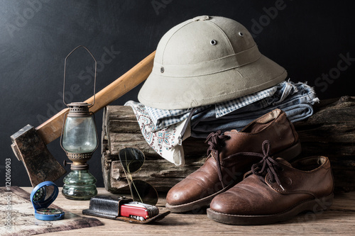 Fotografija still life photography : axe, compass, hunter hat, jeans, lamp, leather shoe, ma
