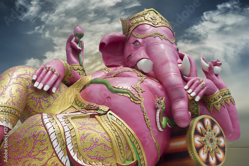 Ganesha,Hindu God and the god of success,Ganesha statue against blue sky on morning moment in background
