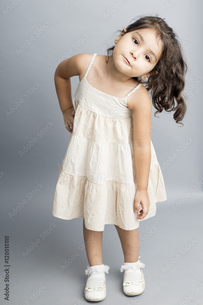 Small girl playing and posing isoated inside studio Small girl playing and posing isoated inside studio