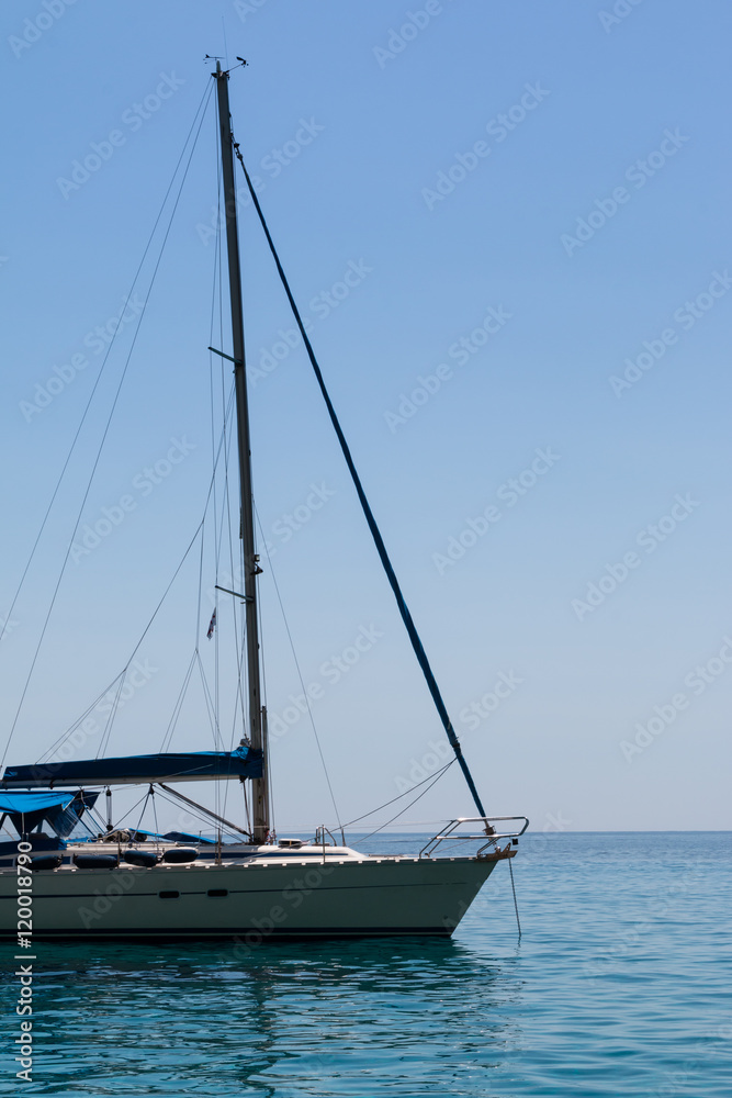 Closeup of Sailboat's Bow Anchored on Serene Sea