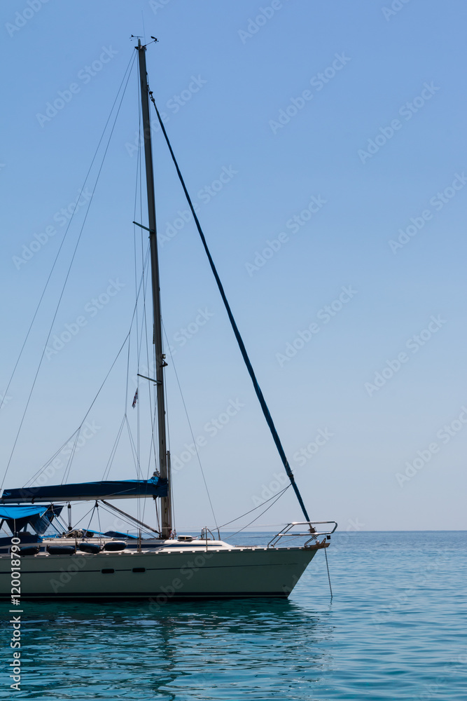 Closeup of Sailboat's Bow Anchored on Serene Sea Closeup of Sailboat's Bow Anchored on Serene Sea