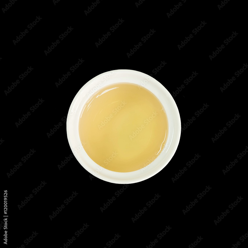 Closeup brown tea in white ceramic cup isolated on black background in top view with clipping path Closeup brown tea in white ceramic cup isolated on black background in top view with clipping path