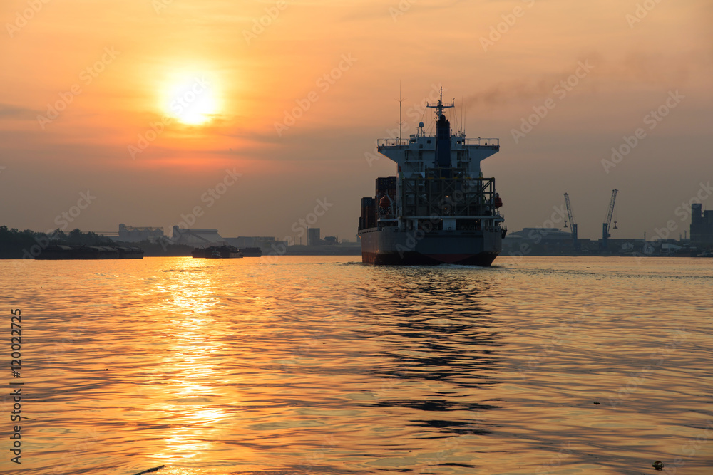 Cargo ship at sunset