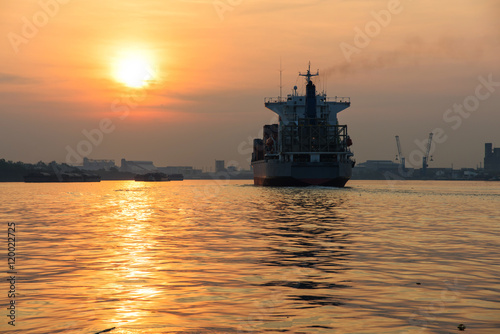 Cargo ship at sunset © Blanscape
