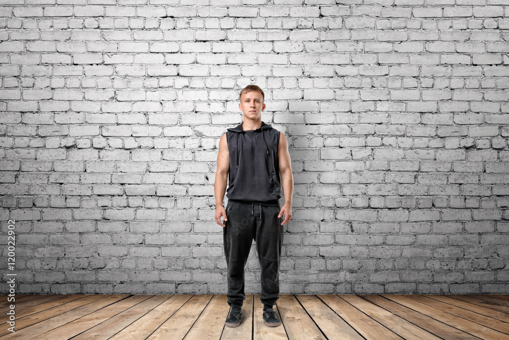 Front view of muscled young man standing Front view of muscled young man standing