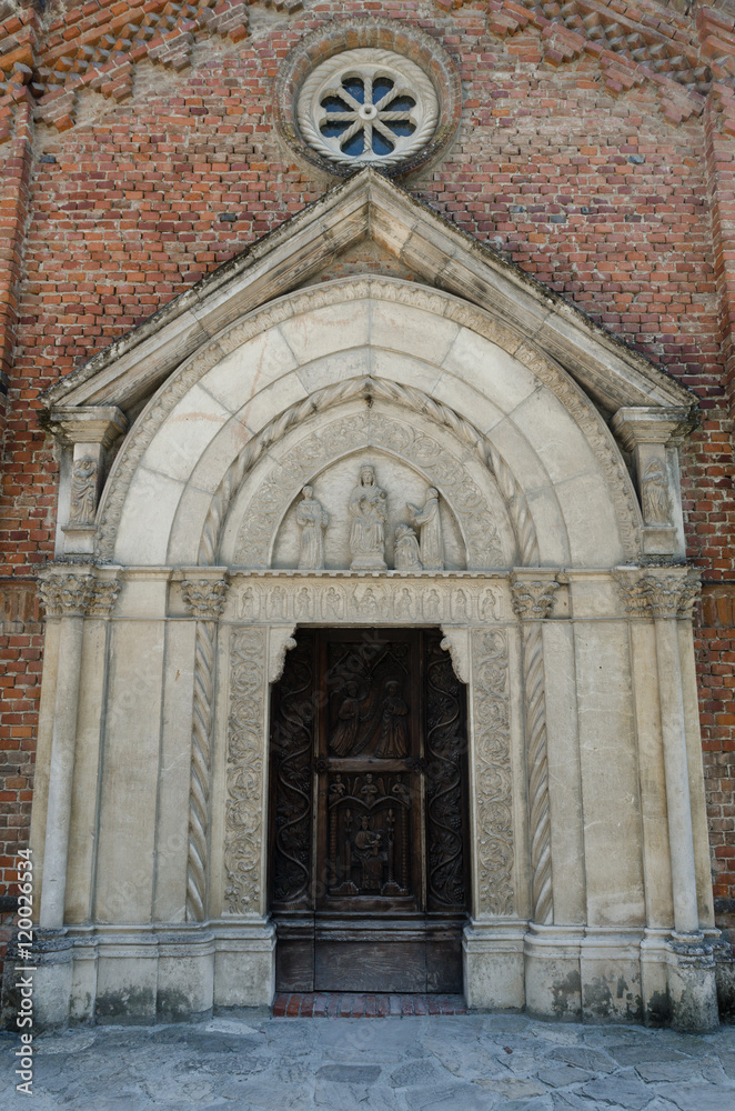 medieval church portal in Grazzano Visconti, Italy