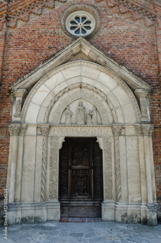 medieval church portal in Grazzano Visconti, Italy