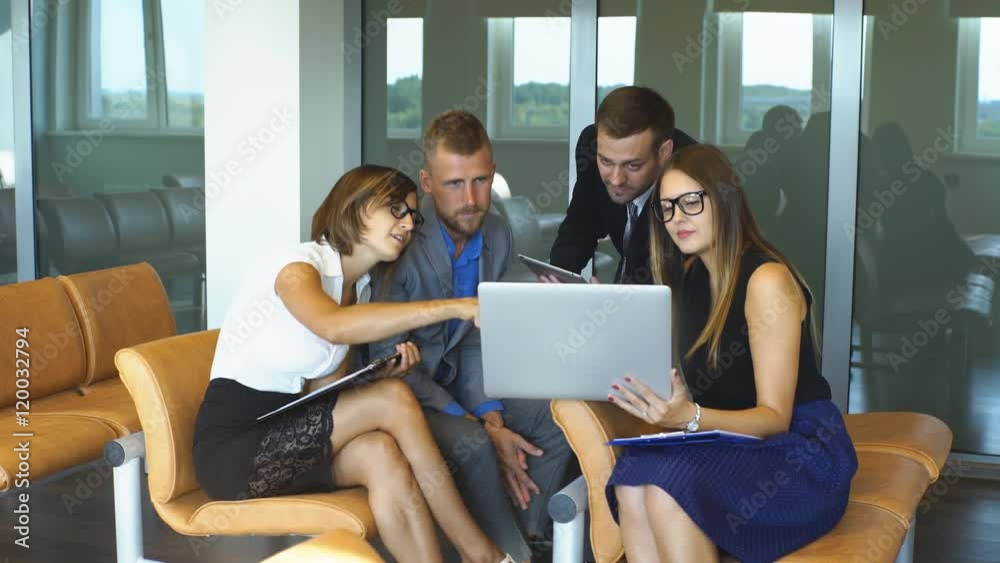 Four business people working at meeting Four business people working at meeting