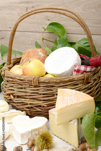 french cheeses with a basket of apples