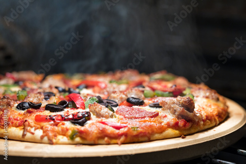 Hot Steaming Pizza in Oven