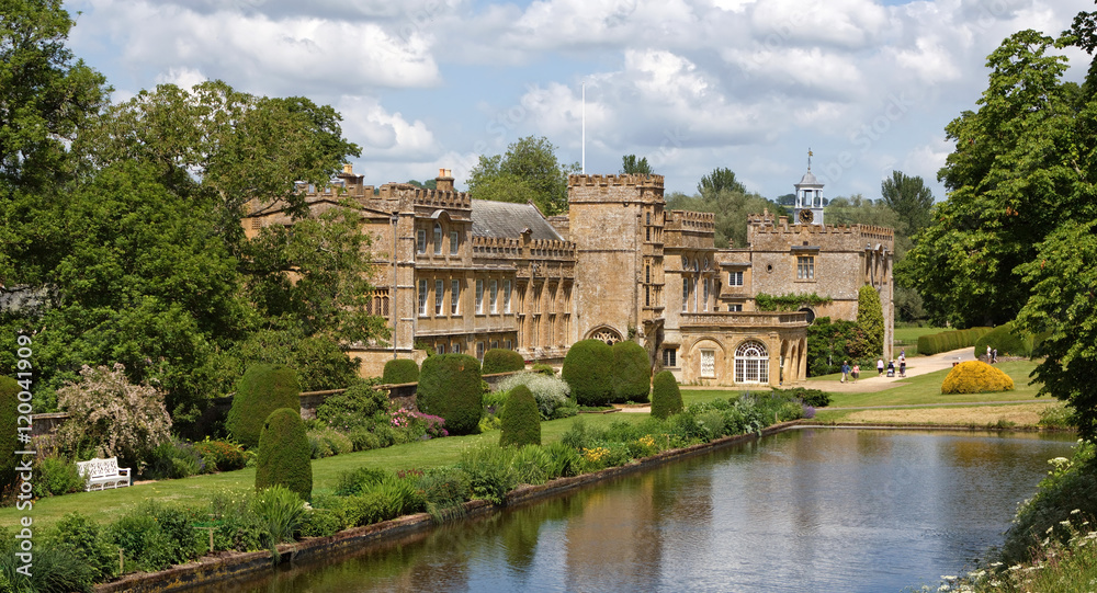 The Forde Abbey mansion from beside its ornamental pond and formal gardens.