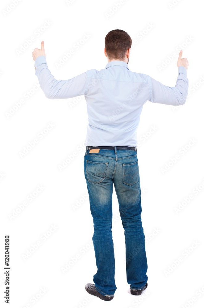 Back view of business man shows thumbs up. businessman in white shirt showing a sign of success in both hands. Back view of business man shows thumbs up. businessman in white shirt showing a sign of success in both hands.