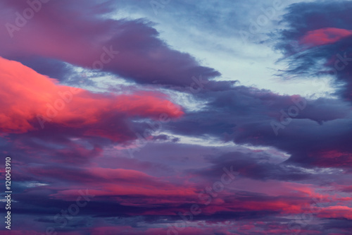Saturated Red and Purple Clouds on Twilght Sky Background