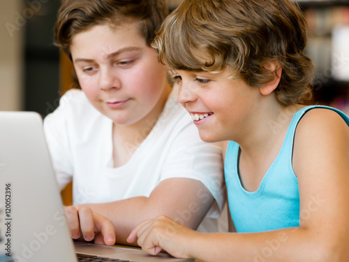 Two boys in library