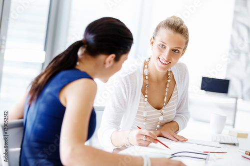 Two female colleagues in office © Sergey Nivens