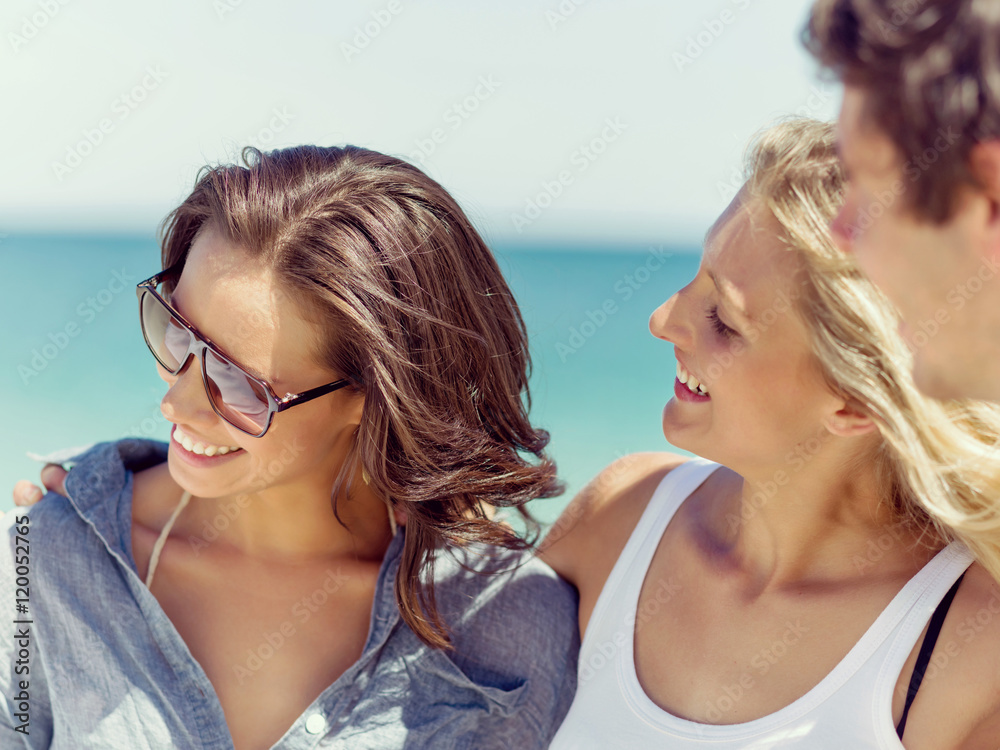 Company of young people on the beach