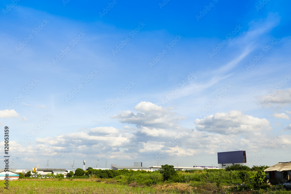 Blue sky with clouds over field Blue sky with clouds over field