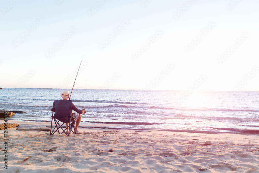 Senior man fishing at sea side Senior man fishing at sea side