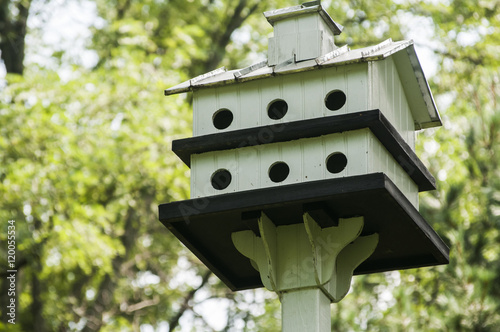 White painted wooden two storey bird house