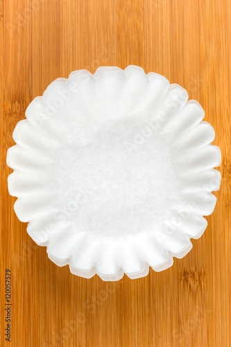 Coffee filters isolated on wood background