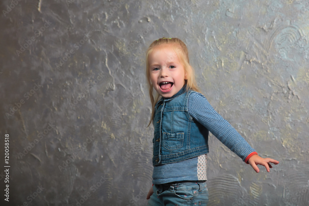 Cute little girl dancing, jumping, smiling and posing to camera Cute little girl dancing, jumping, smiling and posing to camera