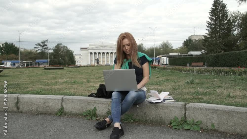 A student works on a computer A student works on a computer