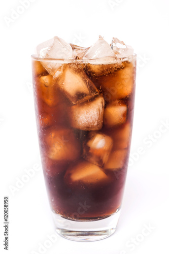 Cola in a glass with dancing bubbles on ice cubes isolated on white background