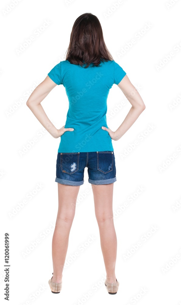 back view of standing young beautiful brunette woman in shorts. girl watching. Rear view people collection. backside view of person. Isolated over white background. back view of standing young beautiful brunette woman in shorts. girl watching. Rear view people collection. backside view of person. Isolated over white background.