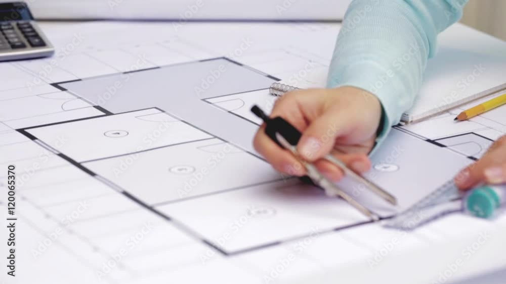 architect woman measuring blueprint with compass architect woman measuring blueprint with compass
