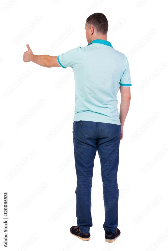 Back view of man in checkered shirt shows thumbs up. Rear view people collection. backside view of person. Isolated over white background. Back view of man in checkered shirt shows thumbs up. Rear view people collection. backside view of person. Isolated over white background.