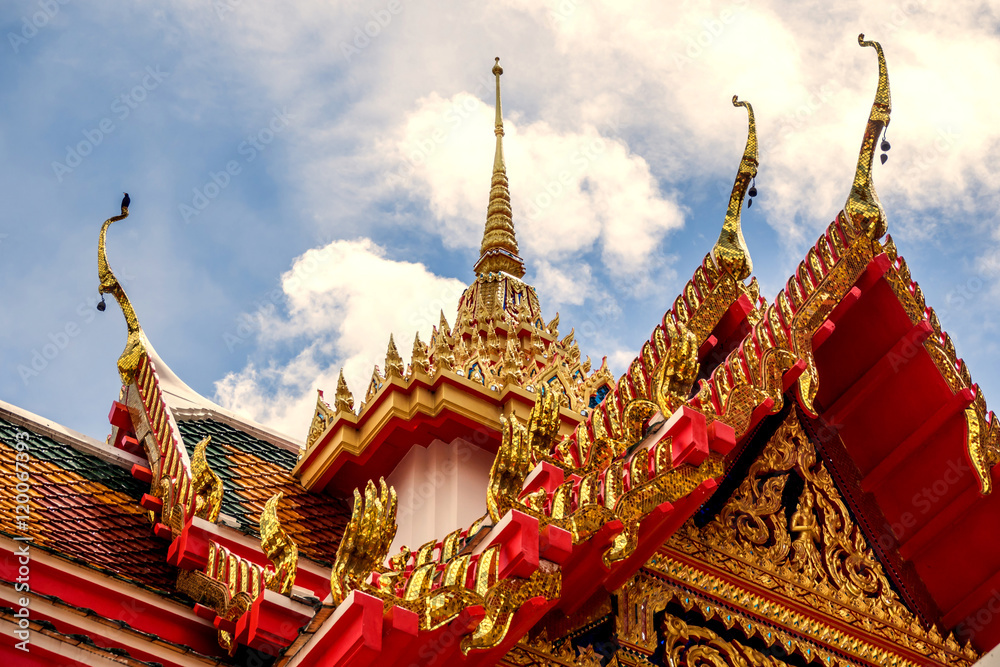 Fototapeta premium Thailand temple on a cloudy sky with the sun.