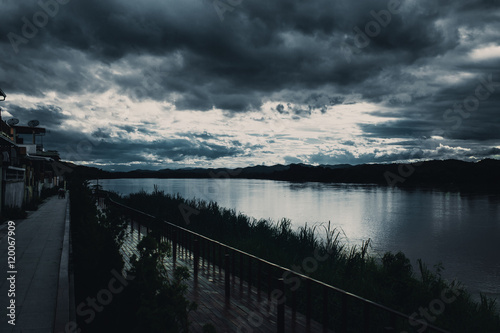 Dark storm sky over the night river. © Quality Stock Arts