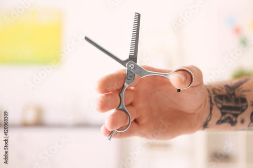 Hairdresser holding profess...