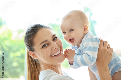 Mother and baby on light background