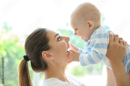 Mother and baby on light ba...