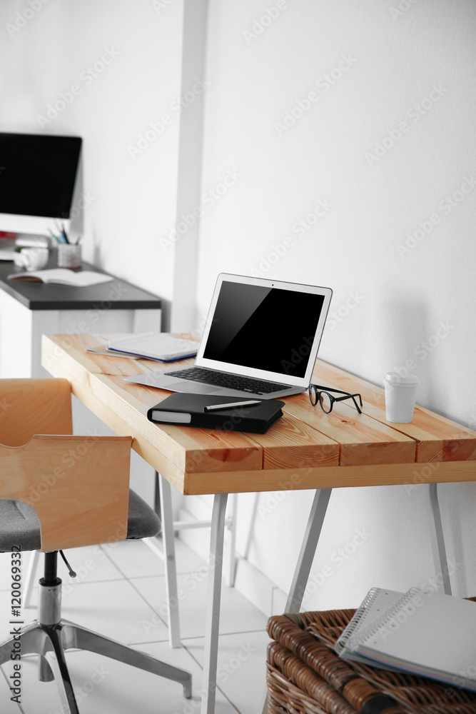 Working place on white wall background Working place on white wall background