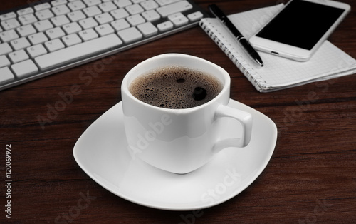 Cup of coffee on modern workplace