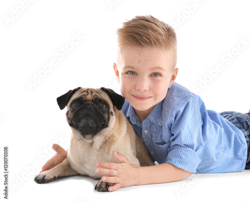 Cute boy with pug dog on wh...