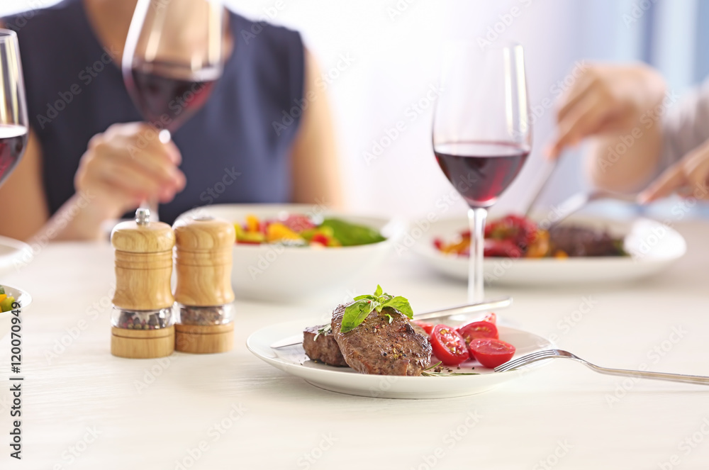 Tasty steak with fresh tomatoes on table Tasty steak with fresh tomatoes on table