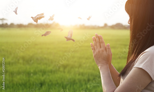 Woman respect and pray on nature background