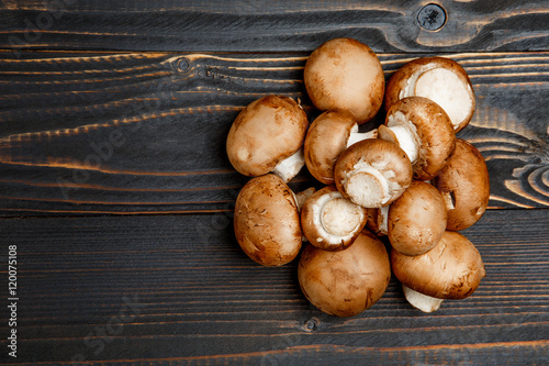 champignon mushroom on wooden background