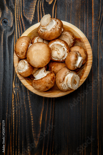 champignon mushroom on wooden background