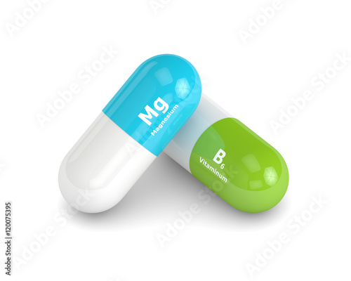 3d rendering of magnesium nad vitaminum B6 pill over white backg photo
