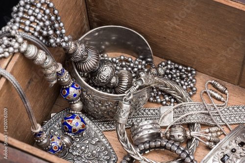 traditional silver jewelry in old wood box photo